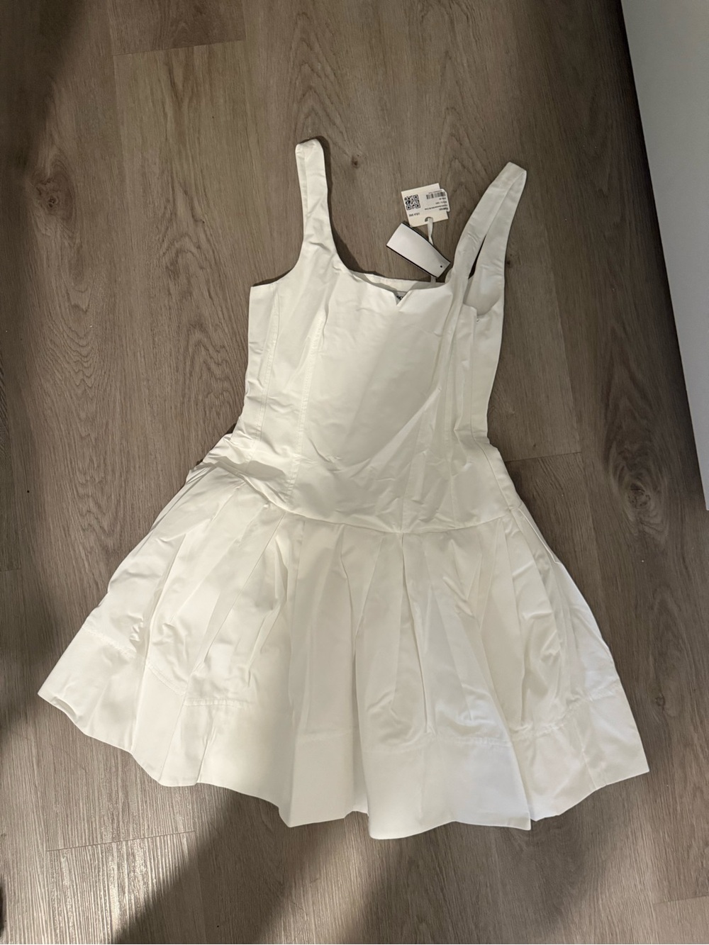 SIMKHAI white Lucy sleeveless drop-waist mini dress.